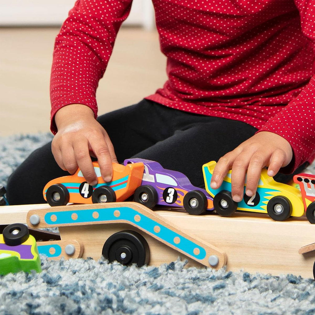 Melissa & Doug Mega Race-Car Carrier - Wooden Tractor and Trailer With 6 Unique Race Cars